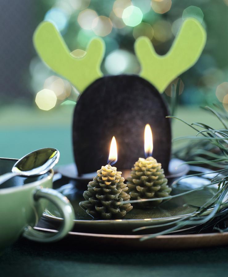 Place Setting Festively Decorated With Pine-cone-shapes Candles Photograph by Matteo Manduzio
