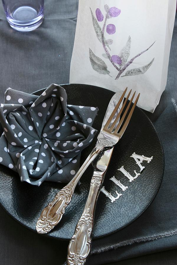 Place Setting; Napkin Folded Into Lotus Flower, Tealight In Translucent Paper Bag And Letters On Plate Photograph by Regina Hippel