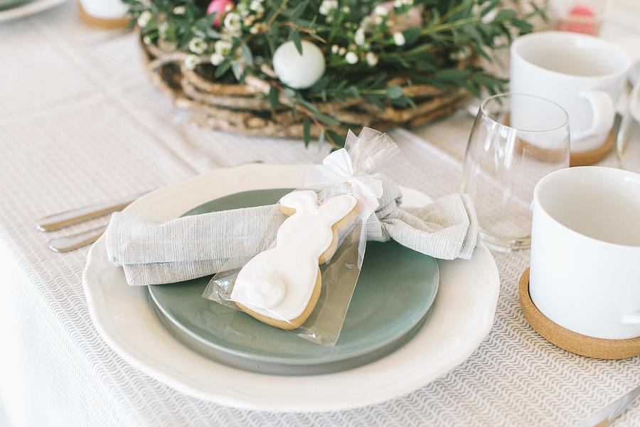 Place Setting With Bunny Biscuit In Gift Bag On Table Set For Easter Photograph by Katja Heil