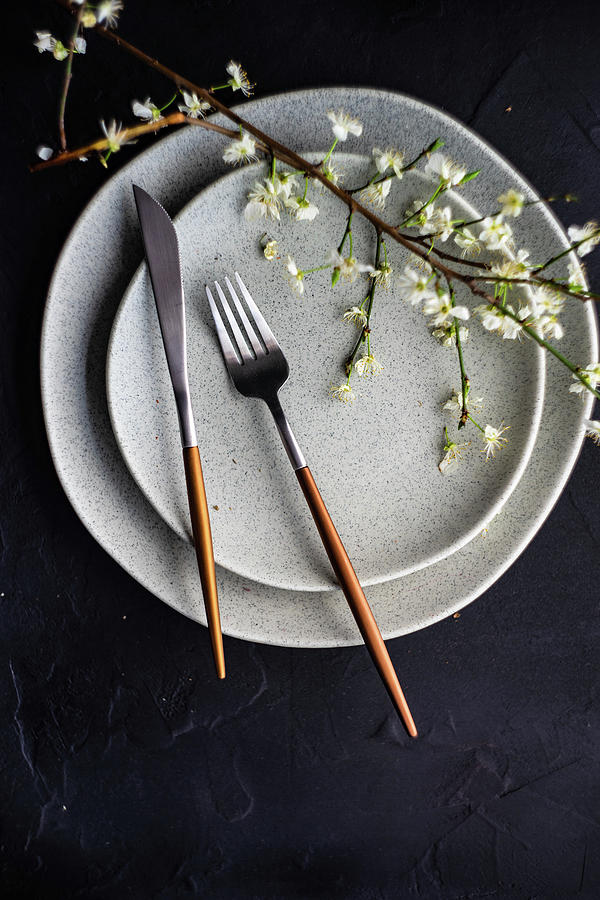 Place Setting With Peach Blossom Branch On Grey Plates Photograph by Anna Bogush