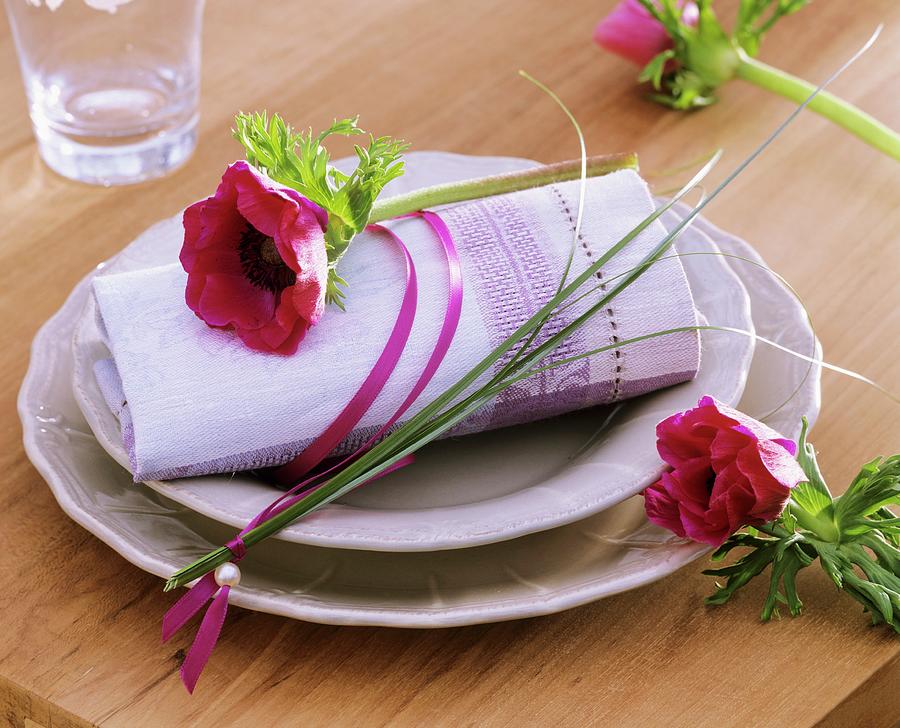Place-setting With Poppy Anemone And Bear Grass On Napkin Photograph by Strauss, Friedrich
