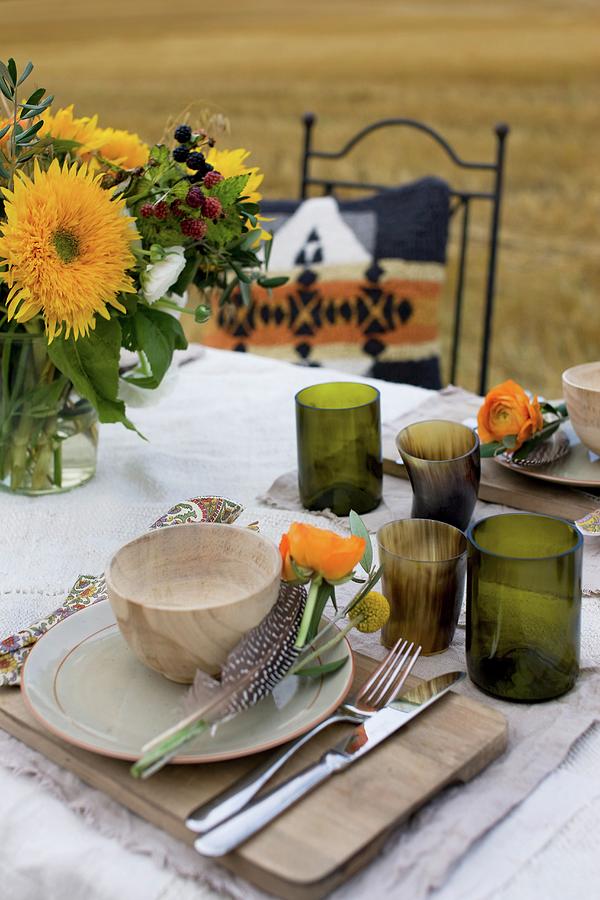 Place Setting With Wooden Bowl, Horn Beaker And Posy With Guinea Fowl Feather Photograph by Annette Nordstrom