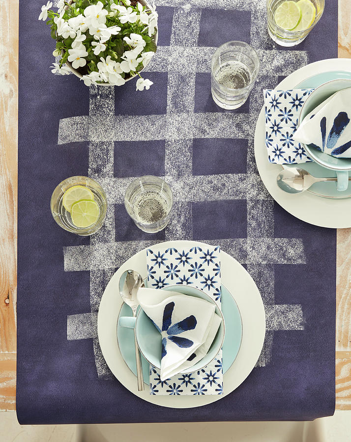 Place Settings With White And Blue Serviettes On Purple Tablecloth Photograph by Greenhaus Press