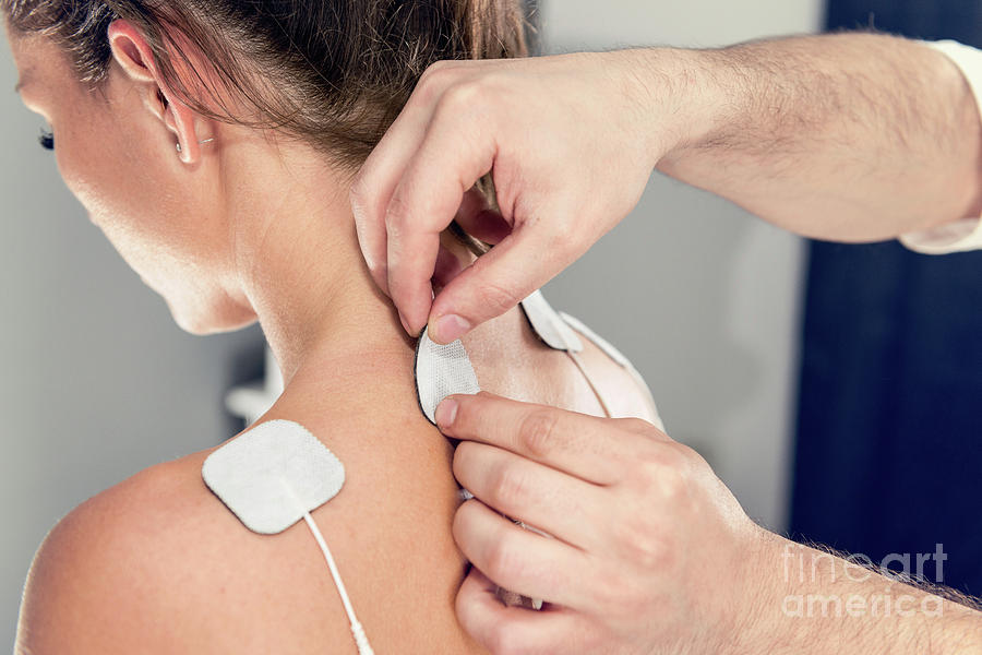 Physical Therapy Photograph - Placing Tens Electrodes On Shoulders by Microgen Images/science Photo Library