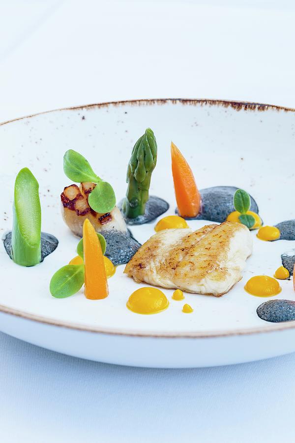 Plaice Fillet With Scallops, Carrot Cream And Black Garlic Butter Photograph by Jalag / Miquel Gonzalez