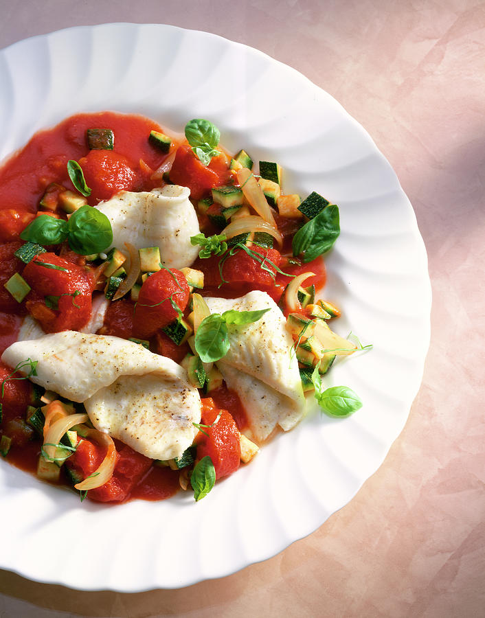 Plaice Fillets In Tomato Sauce With Vegetables On Plate Photograph by ...