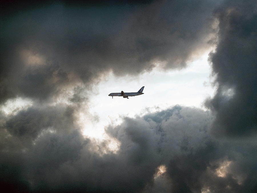 Plane Flying Among Stormy Clouds Photograph by Photo By Rafa Elias