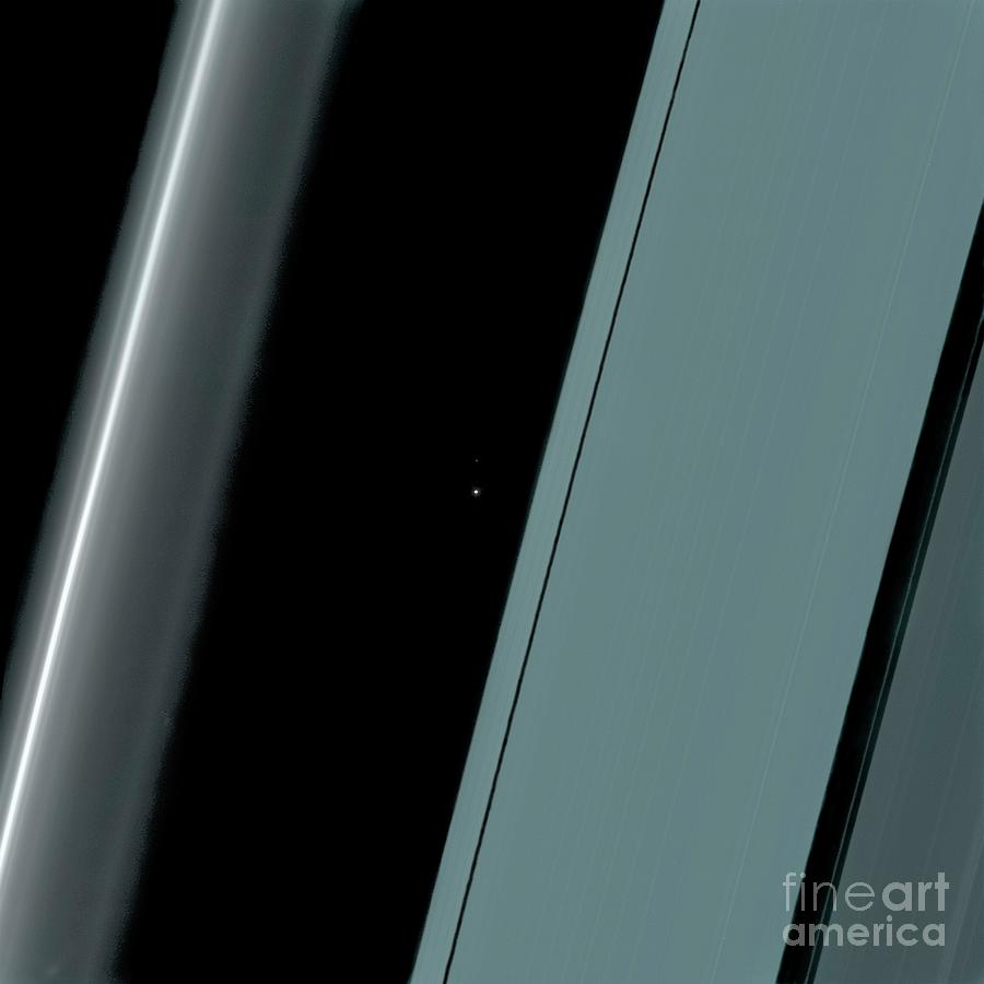 Planet Earth Seen Through The Rings Of Saturn Photograph by Nasa/jpl-caltech/ssi/science Photo Library