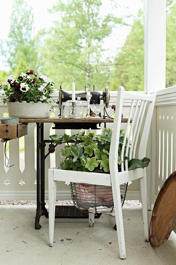 Planted Chair And Antique Sewing Machine On Veranda Photograph by Cecilia Mller