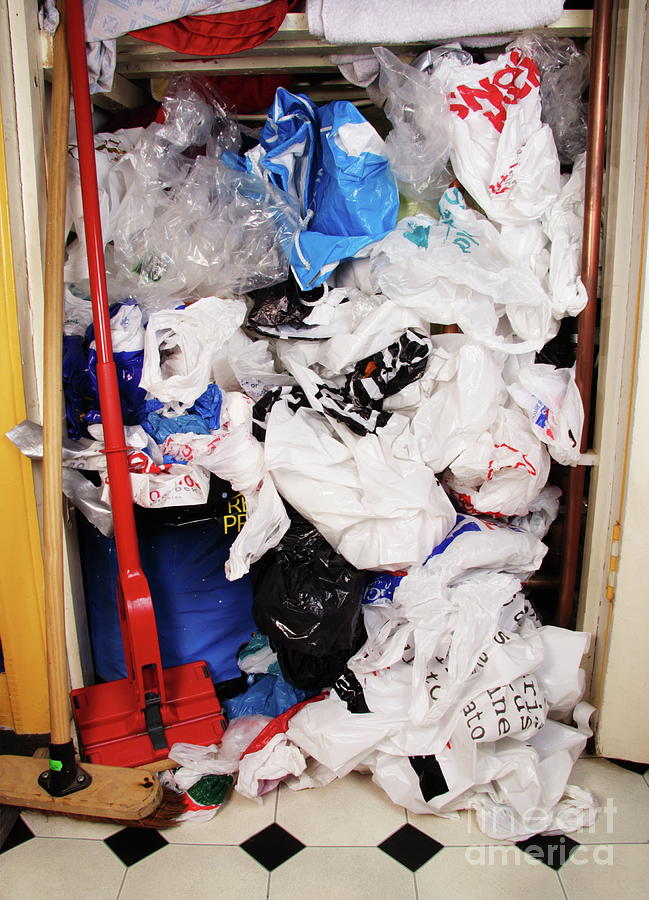 Plastic Bags In Cupboard Photograph by Cordelia Molloy/science Photo Library