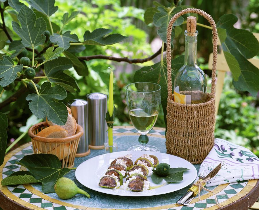 Plate Of Figs And Ricotta And White Wine On Garden Table Photograph by Friedrich Strauss