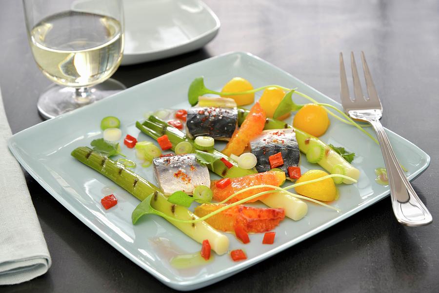 Plate Of Leeks With Red Pepper Vinaigrette, Mackerels, Orange Segments And Small Melon Balls Photograph by Gelberger