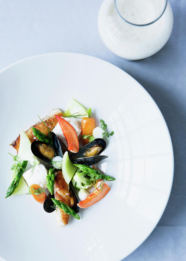 Plate Of Mussels With Salad Photograph by Line Klein