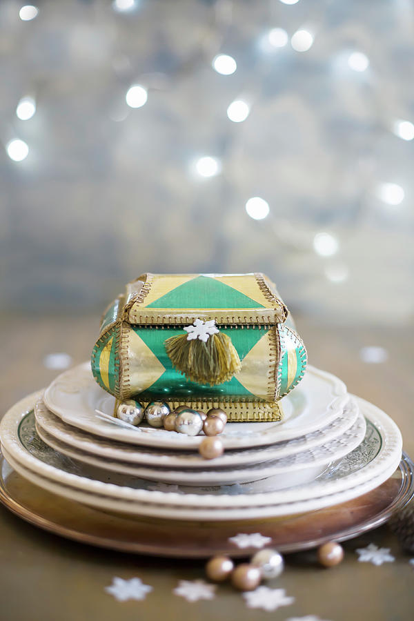 Plates And Jewellery Box With Christmas Decorations Photograph by Alicja Koll