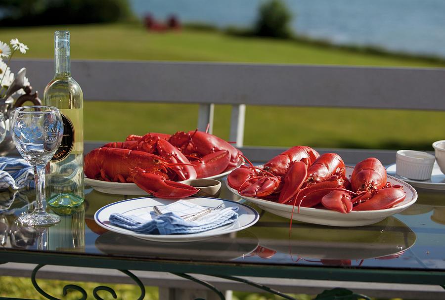Platters Of Cooked Lobsters On An Outdoor Table; White Wine Photograph by Strokin, Yelena