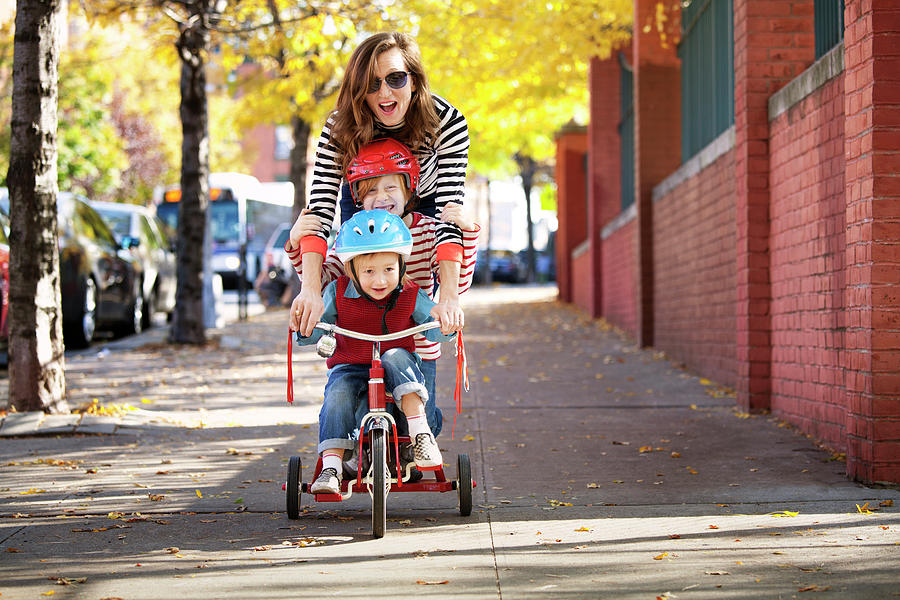 Playful Mother With Children Cycling On Footpath Photograph by Cavan Images Playful Mother With Children Cycling On Footpath Photograph by Cavan Images