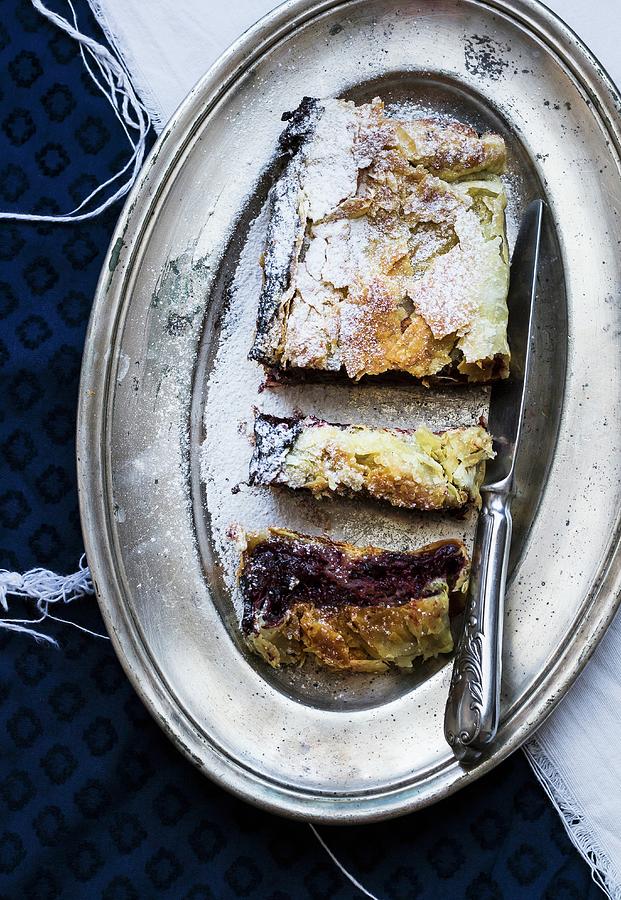 Plum And Chocolate Strudel On A Silver Plate Photograph by Adel Bekefi