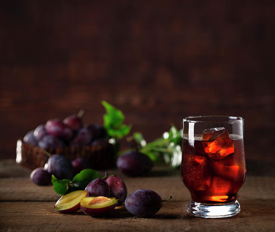 Plum Drink With Ice Cubes And Fresh Plums Photograph by Christian Schuster