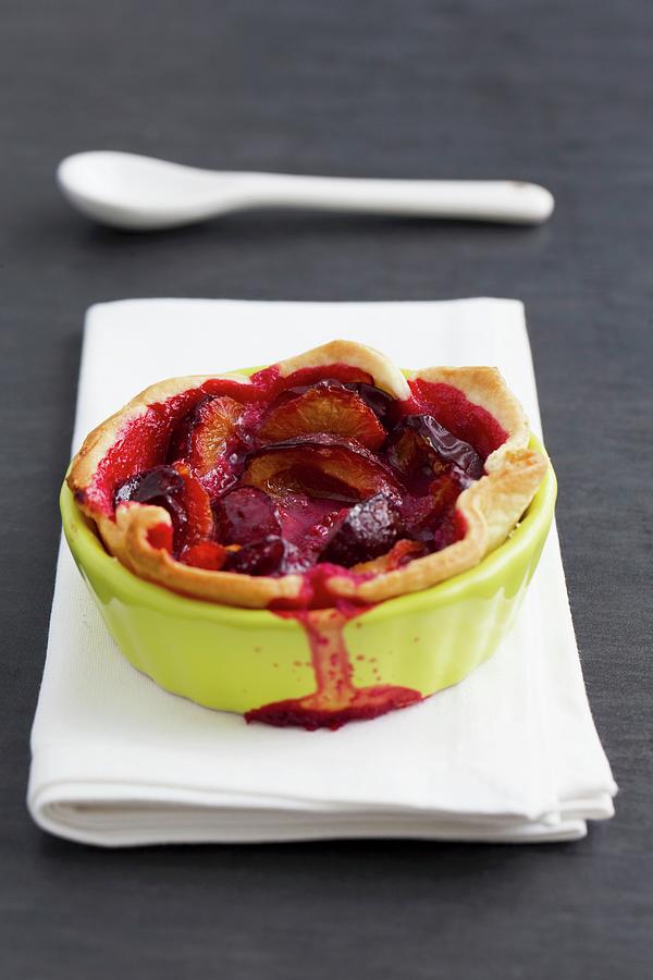 Plum Tartlet In A Baking Dish Photograph by Lydie Besancon