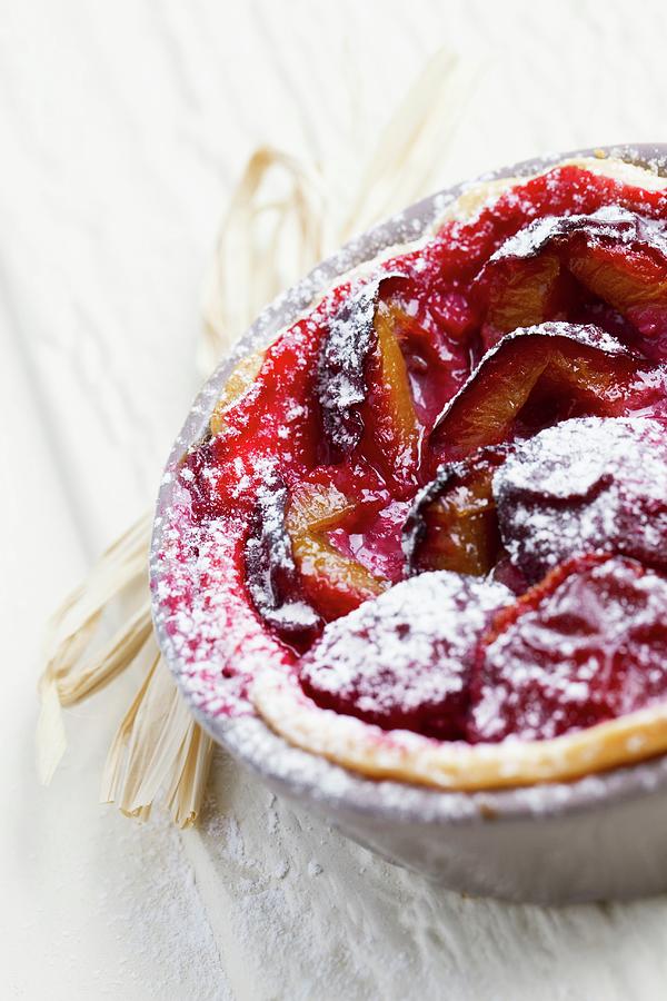 Plum Tartlet With Icing Sugar In A Baking Dish close-up Photograph by Lydie Besancon