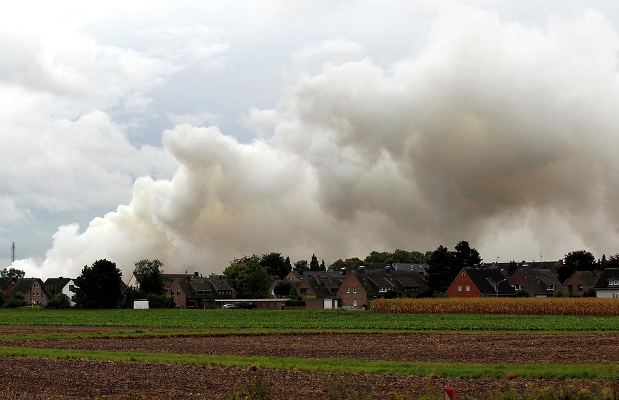 Plumes Of Smoke Billow Into Sky Photograph By Ina Fassbender - Fine Art ...