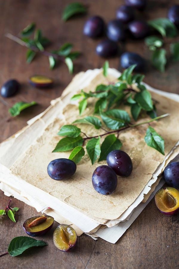 Plums And An Old Recipe Notebook Photograph by Malgorzata Laniak