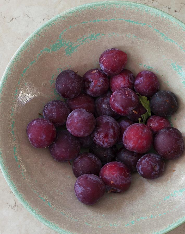 Plums In A Ceramic Bowl Photograph by Yelena Strokin
