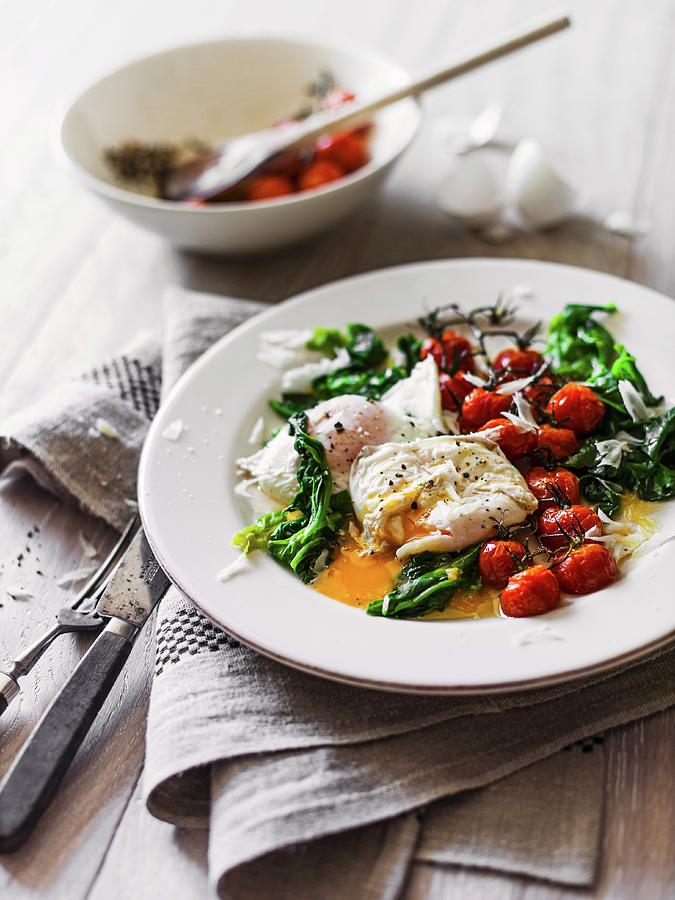 Poached Egg With Spinach And Oven-roasted Tomatoes Photograph by Thorsten Kleine Holthaus