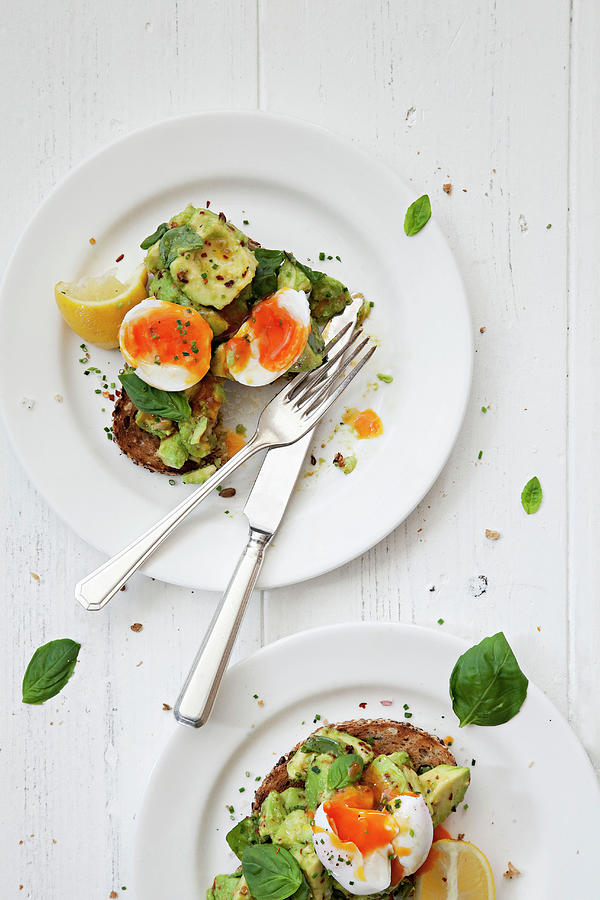 Poached Eggs And Smashed Avocado S On Granary Toast Photograph by Steven Joyce