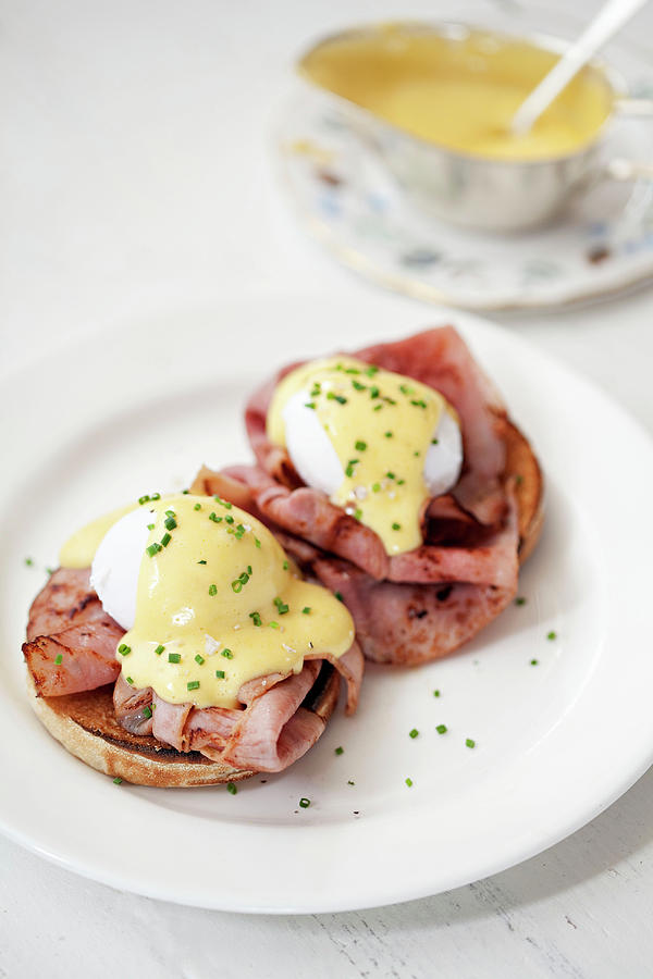 Poached Eggs With Hollandaise Sauce On Top Of Bacon And A Muffin Photograph by Steven Joyce