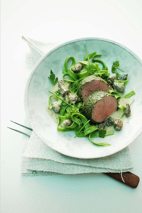 Poached Fillet Of Veal In A Herb Coating With A Creamy Morel Mushroom Sauce And Green Pasta Photograph by Michael Wissing
