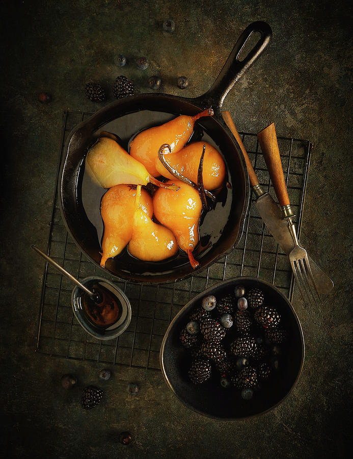 Poached Pears With Honey And Vanilla Served With Berries Photograph by Vadim Piskarev