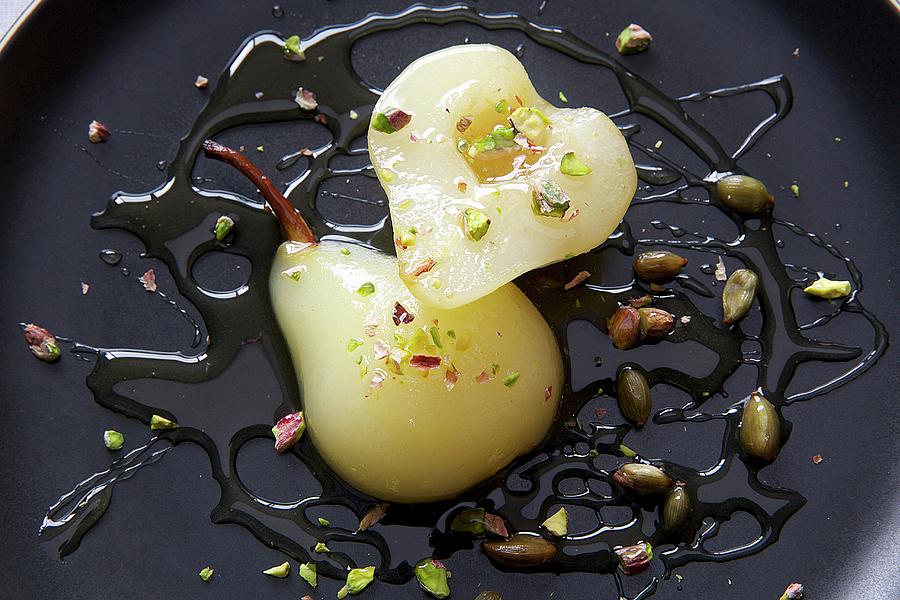 Poached Pears With Pistachios Photograph by Hugh Johnson