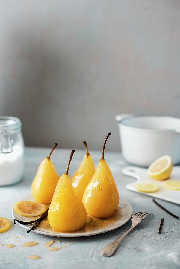 Poached Pears With Vanilla And Lemon Syrup Photograph by Magdalena Hendey