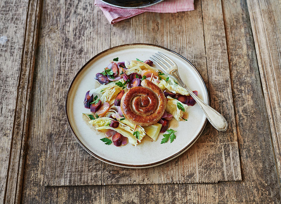 Pointed Cabbage Stew With A Bratwurst Snail Photograph by Stefan Schulte-ladbeck