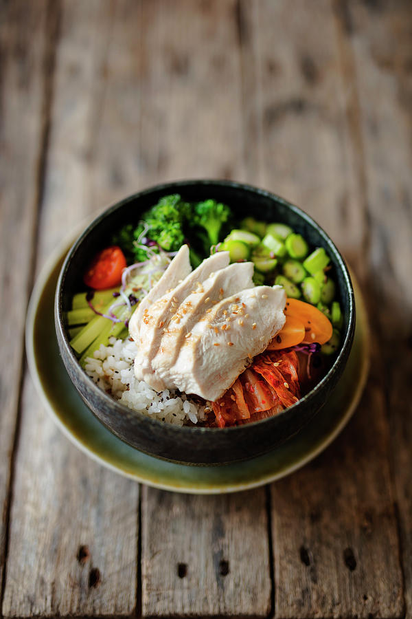 Poke Bowl With Chicken Breast Fillet, Broccoli, Green Asparagus, Rice And Kimchi Photograph by Jan Wischnewski