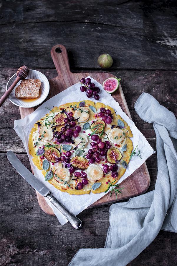 Polenta Pizza With Goats Cheese, Figs And Red Grapes Photograph by Carolin Strothe