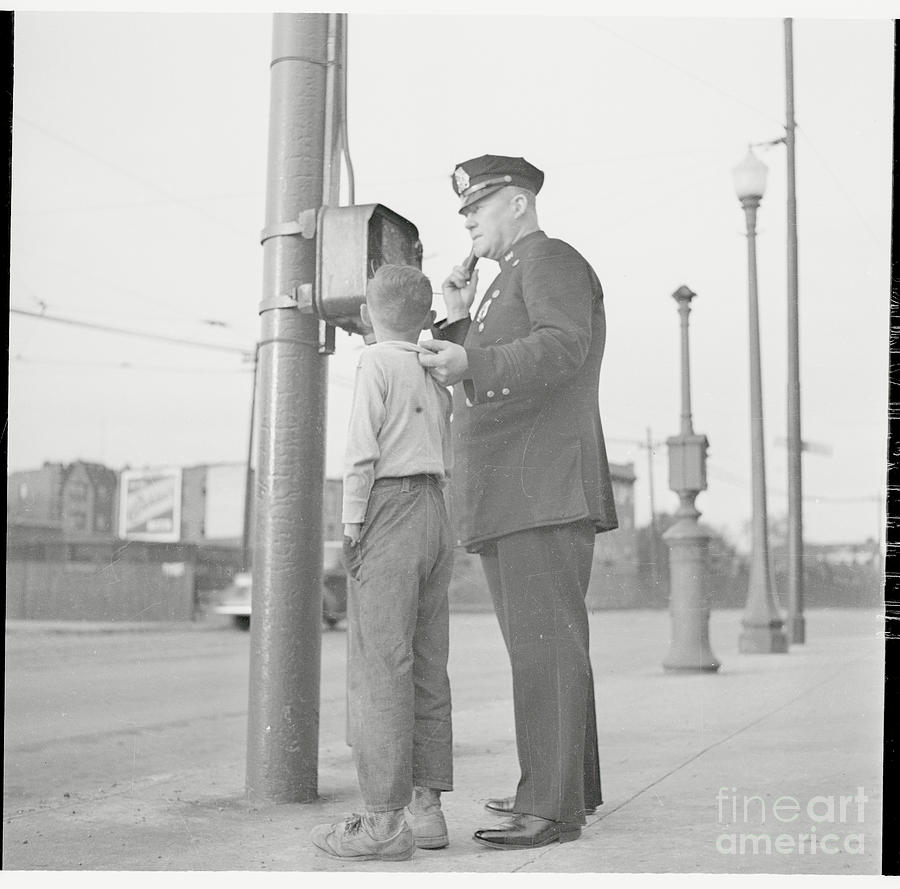 Police Using Telephone With Young Photograph by Bettmann