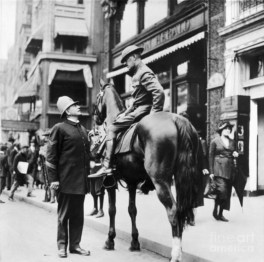 Policeman Talking To Soldier On Horse Photograph by Bettmann