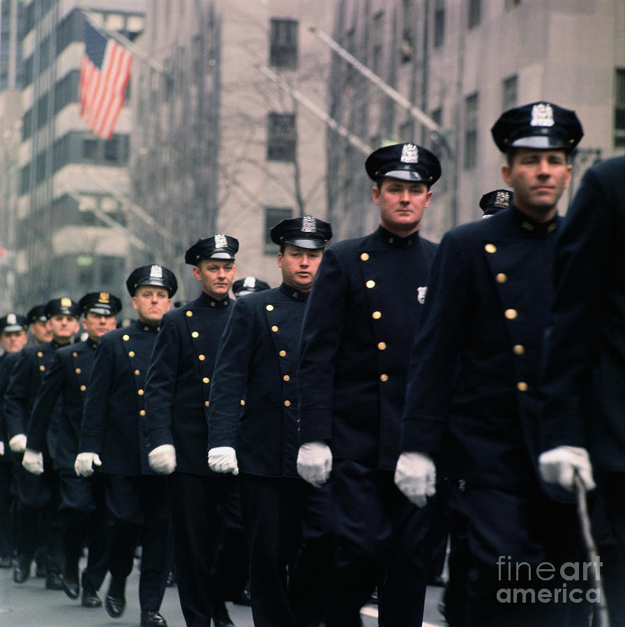 Policemen Marching In Parade Photograph by Bettmann