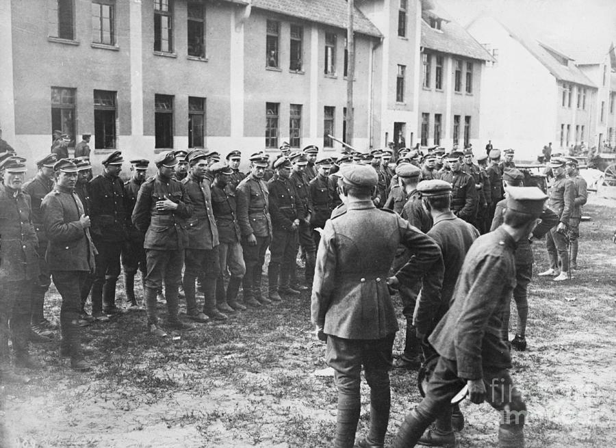 Polish Officer Grouping His Men by Bettmann