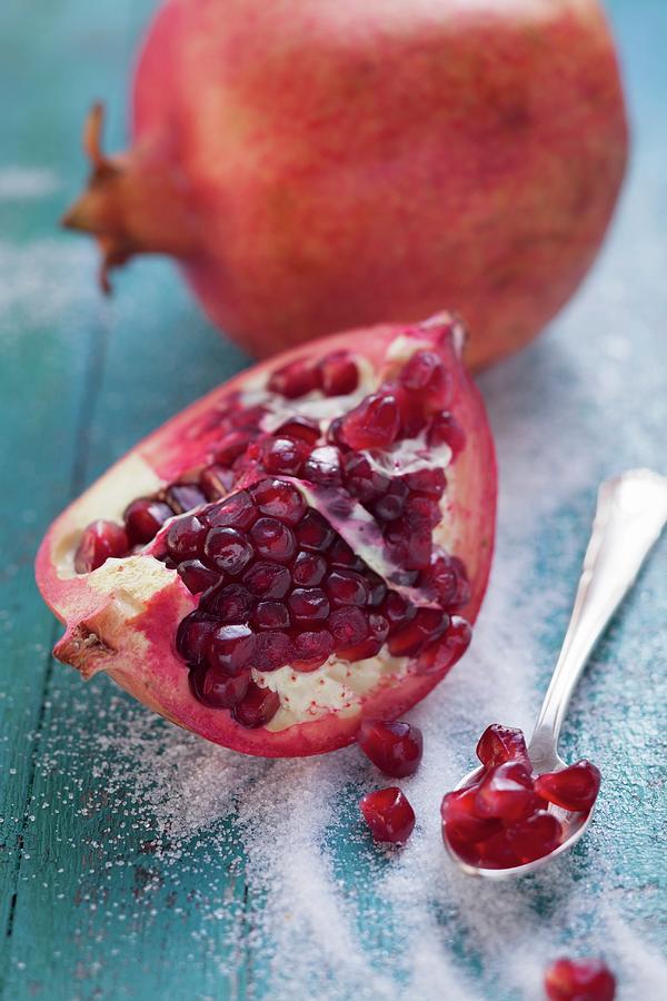 Pomegranate And Pomegranate Seeds Photograph by Eising Studio - Food Photo & Video