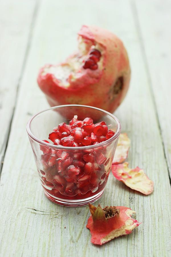 Pomegranate Seeds And A Pomegranate Photograph by Gross, Petr