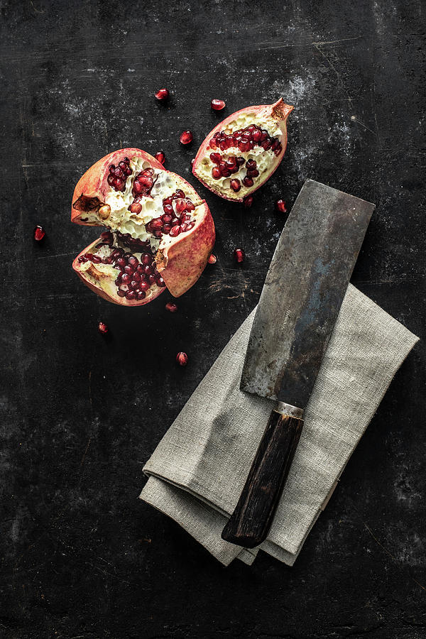 Pomegranate, Sliced, With Cleaver Photograph by Salt & Sugar