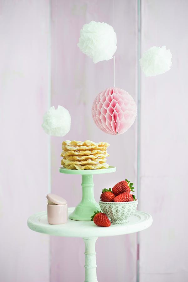 Pompoms And Honeycomb Ball Above Waffles And Strawberries On Table Photograph by Ulla@patsy