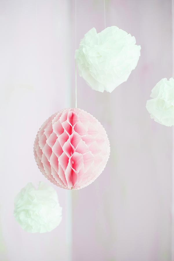 Pompoms And Honeycomb Paper Ball Suspended From Ceiling Photograph by Ulla@patsy