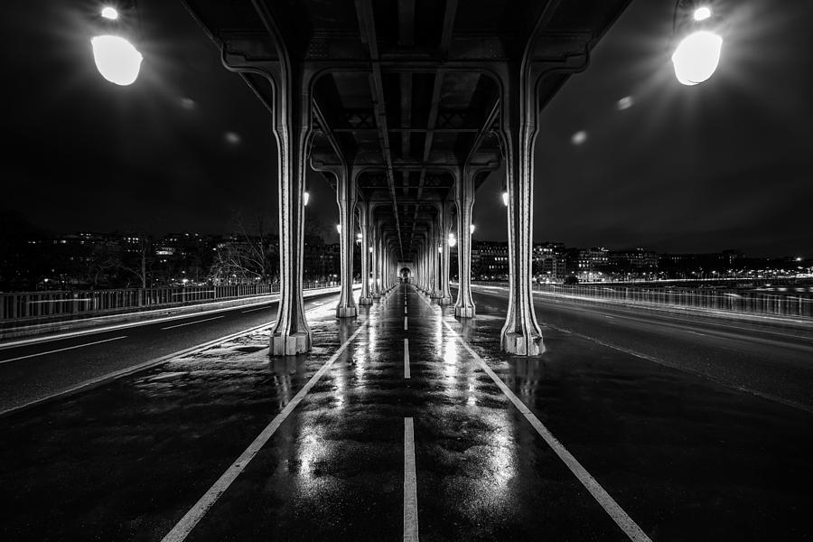 Inception Photograph - Pont de bir Hakeim bridge from the movie Inception located in Paris, France, seen on a rainy night. by George Afostovremea