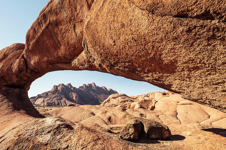 Pontok Mountains, Seen Thorugh A Rock Arch, Spitzkoppe, Erongo, Namibia. Photograph by Wilfried Feder