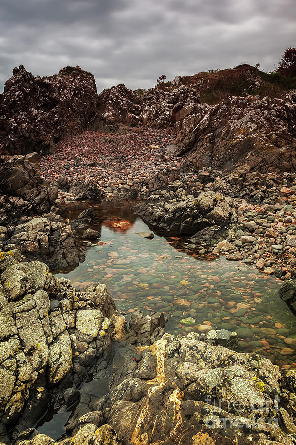 Pool of water by cliffs Photograph by Sophie McAulay