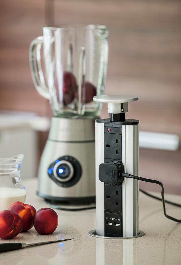 Pop-up Multiway Power Strip And Jug Blender In Kitchen Photograph by Brian Harrison